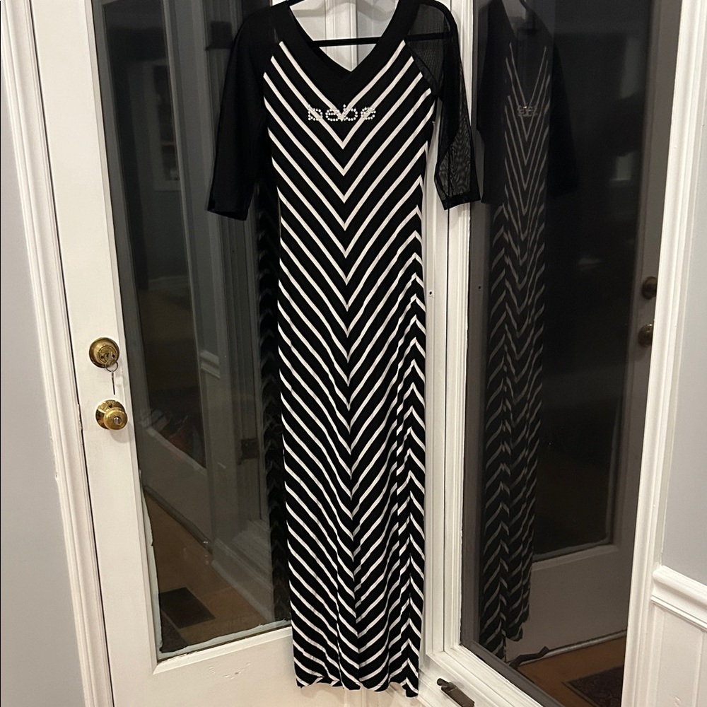 NWT! BeBe Black and White striped maxi dress with 2/4 sheer sleeves!